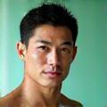 Portrait of Michael Chen, a fitness and movement therapy expert.